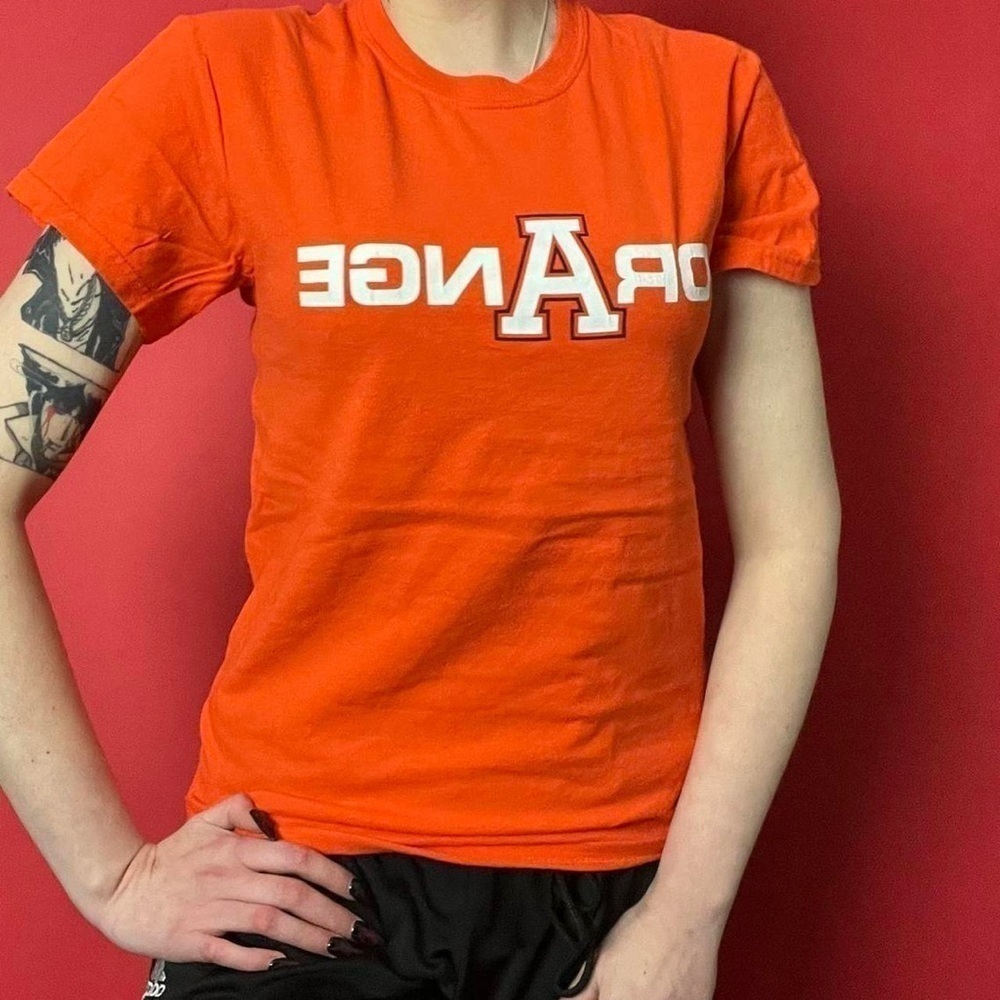 Orange and white graphic tee shirt 🤍🧡